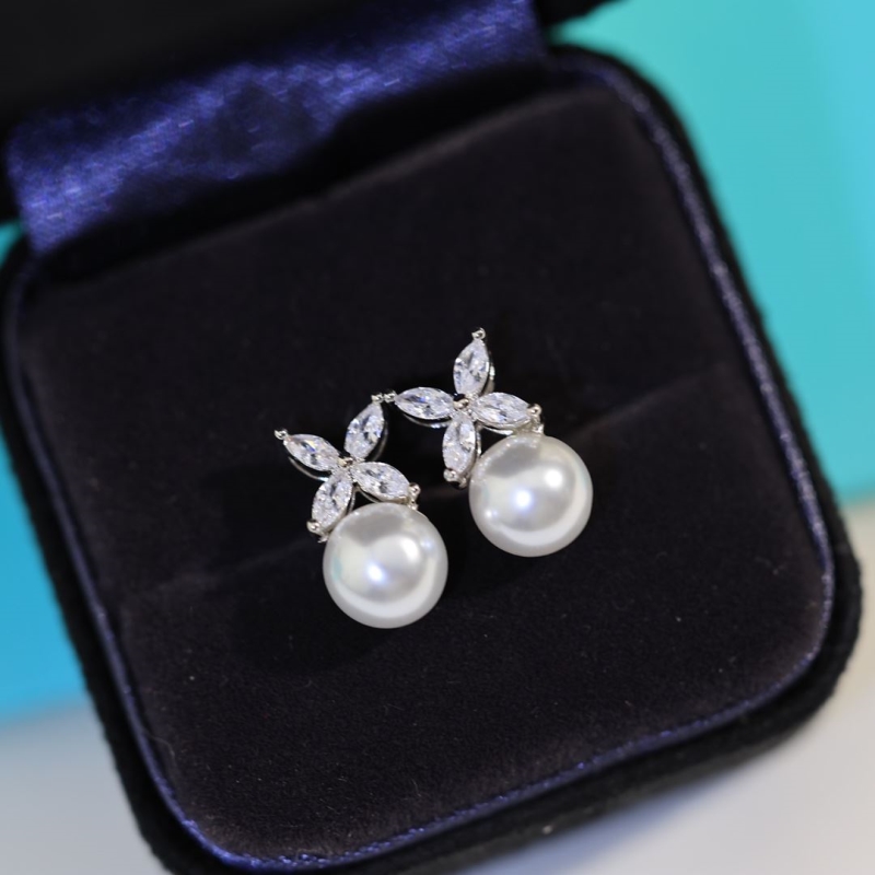 T*f*ny earrings